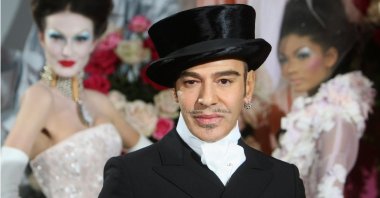 Fashion designer John Galliano poses at the end of the presentation of the Dior Haute Couture spring/summer 2010 fashion collection, Paris, France, Jan. 25, 2010. (AP Photo)
