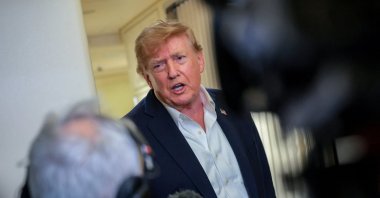 U.S. President Donald Trump speaks to members of the media aboard Air Force One, following a two-day visit to Ireland, Sept. 13, 2026. (Reuters Photo)