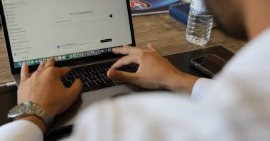 A man uses an AI chatbot on his laptop, Aksaray, central Türkiye, Sept. 6, 2026. (IHA Photo)
