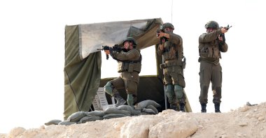 Israeli soldiers provide security during the inauguration of the new illegal Israeli outpost settlement near the Palestinian village of Dura, Hebron, occupied West Bank, Palestine, Aug. 31, 2026. (EPA Photo)
