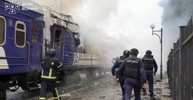 firefighters extinguish fire at a train carriage damaged by a drone strike near the border with Poland, Sept. 12, 2026. (AFP Photo)