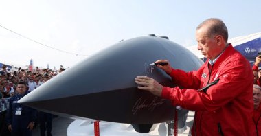 President Recep Tayyip Erdoğan signs a Bayraktar Kızılelma at the Teknofest Black Sea in Samsun, Türkiye, Sept. 3, 2022. (Reuters Photo)