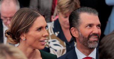 Donald Trump Jr. and his partner Bettina Anderson sit on the day U.S. President Donald Trump delivers remarks to U.S. embassy personnel and business leaders at Deerfield Residence, the residence of the U.S. Ambassador to Ireland, in Dublin, Ireland, Sept. 12, 2026. (Reuters Photo)