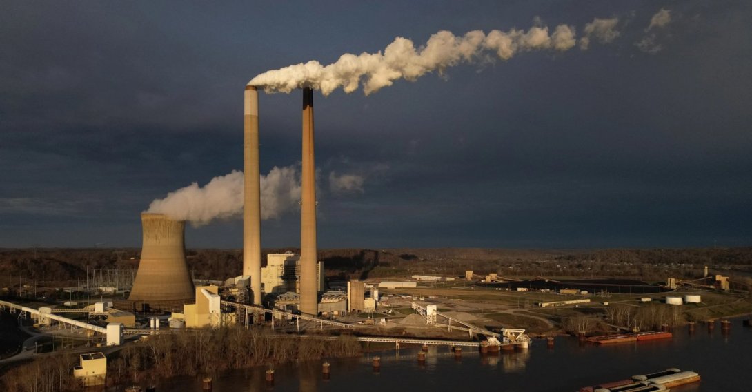 A barge on the Ohio River moves past the Mountaineer Power Plant, a coal-fired power plant near New Haven, U.S., March 13, 2026. (AP Photo)