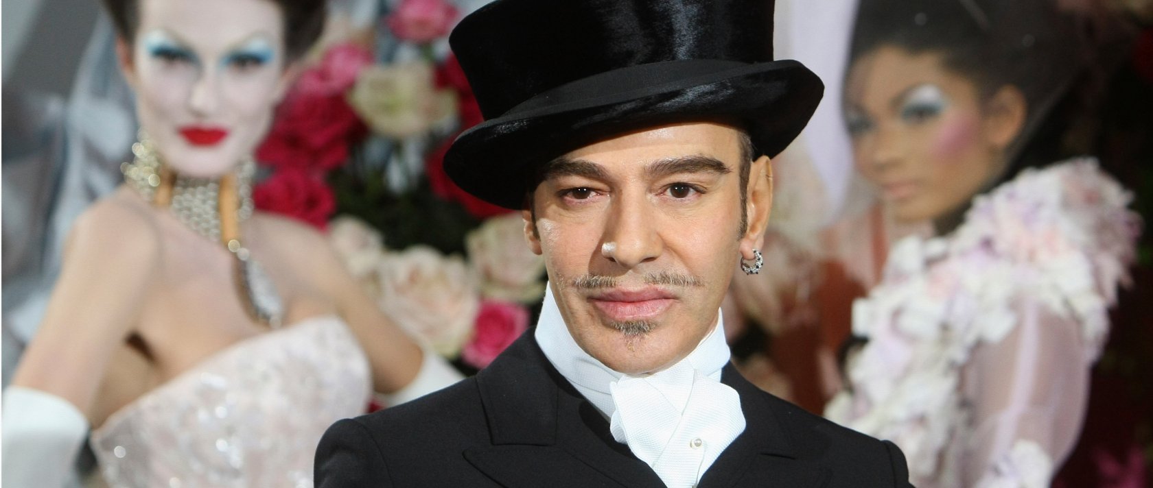 Fashion designer John Galliano poses at the end of the presentation of the Dior Haute Couture spring/summer 2010 fashion collection, Paris, France, Jan. 25, 2010. (AP Photo)