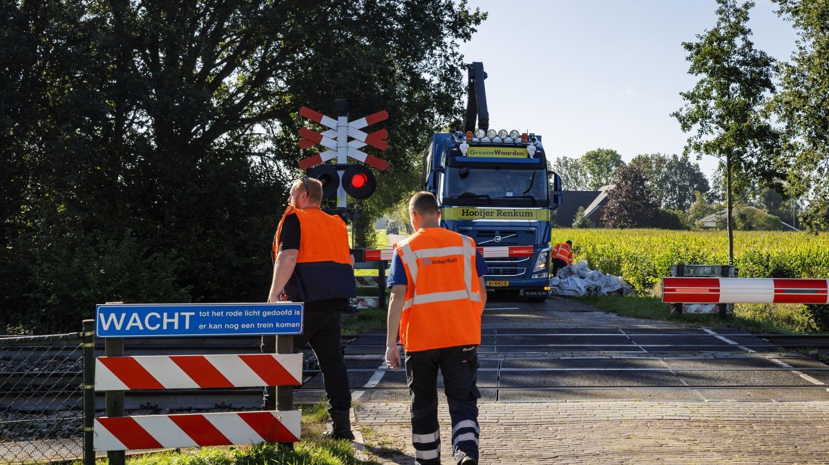 Contractor employees work along the railway line as no trains were running in parts of the country due to a disruption caused by sabotage, Holten, Netherlands, Sept. 15, 2026. (EPA Photo)