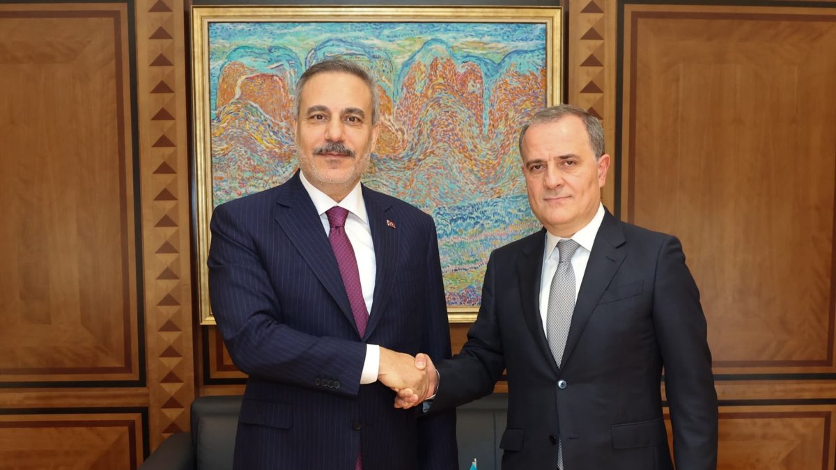 Turkish Foreign Minister Hakan Fidan (L) shakes hands with Azerbaijan's Jeyhun Bayramov, in Baku, Azerbaijan, September 15, 2026. (AA Photo) 