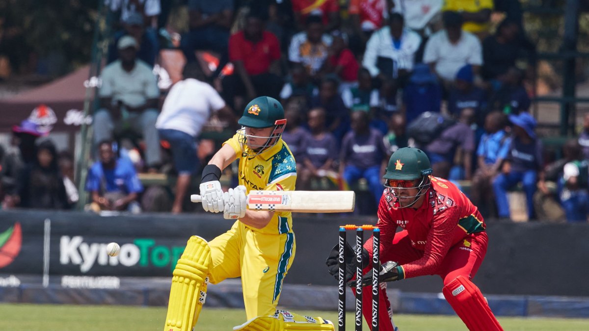 Australia's Oliver Peake plays a shot as wicketkeeper Brendan Taylor watches during the first One Day International series between hosts Zimbabwe and Australia at Harare Sports Club, Harare, Zimbabwe, Sept. 15, 2026. (AFP Photo)