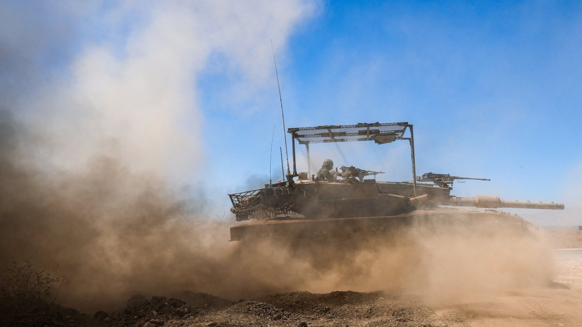An Israeli tank drives along the cease-fire line between the Israeli-occupied Golan Heights and Syria, on its Israeli side, Aug. 20, 2026. (Reuters Photo)