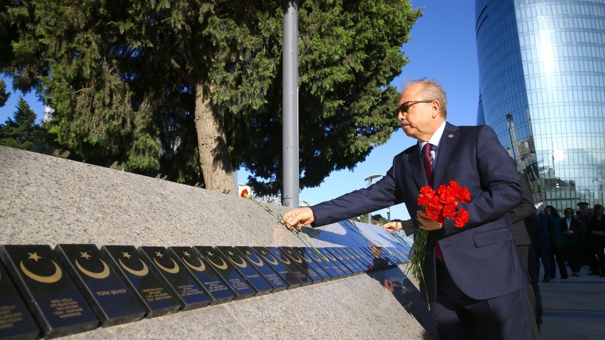 Turkish Ambassador Birol Akgün leaves flowers at the symbolic graves of martyrs, Baku, Azerbaijan, Sept. 15, 2026. (AA Photo)