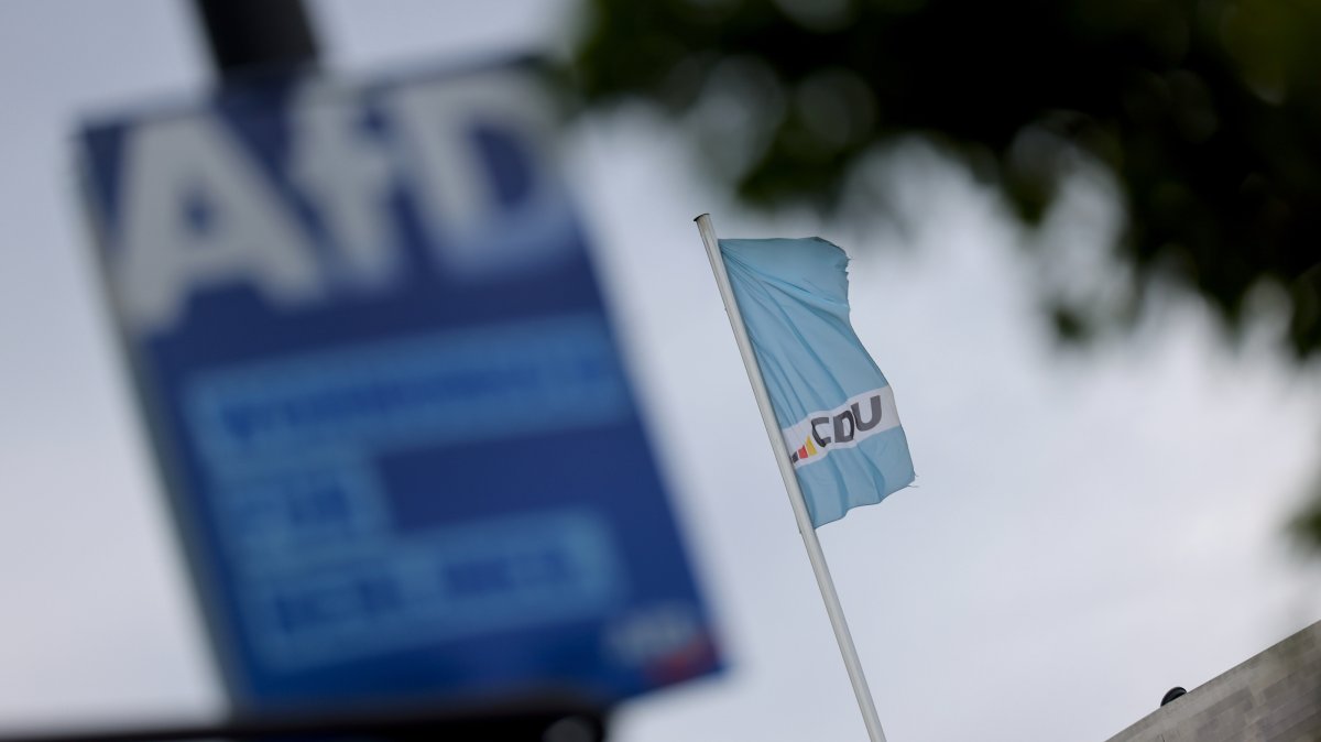A far-right Alternative for Germany (AfD) party election campaign poster on display in front of the Christian Democratic Union (CDU) headquarters in Berlin, Germany, Sept. 7, 2026. (EPA Photo)