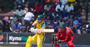 Australia's Oliver Peake plays a shot as wicketkeeper Brendan Taylor watches during the first One Day International series between hosts Zimbabwe and Australia at Harare Sports Club, Harare, Zimbabwe, Sept. 15, 2026. (AFP Photo)