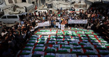 Palestinians attend the mass funeral for members of the Irahem, Malaka, Qanbour, Balawi and Dahdouh families, killed in an Israeli strike in 2023 and whose remains were recovered from beneath the rubble, Gaza City, Palestine, Sept. 6, 2026. (Reuters Photo)