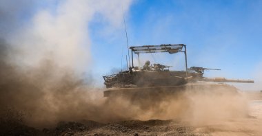 An Israeli tank drives along the cease-fire line between the Israeli-occupied Golan Heights and Syria, on its Israeli side, Aug. 20, 2026. (Reuters Photo)