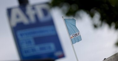 A far-right Alternative for Germany (AfD) party election campaign poster on display in front of the Christian Democratic Union (CDU) headquarters in Berlin, Germany, Sept. 7, 2026. (EPA Photo)