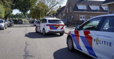 Police at a house where two people have been arrested for graffiti and vandalism in the Brabant villages of Engelen and Bokhoven, Aug. 12, 2026. (AFP File Photo)