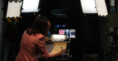 A journalist prepares for a stand-up as President Donald Trump speaks about the Iran war at the White House, April 1, 2026, in Washington. (AP File Photo)