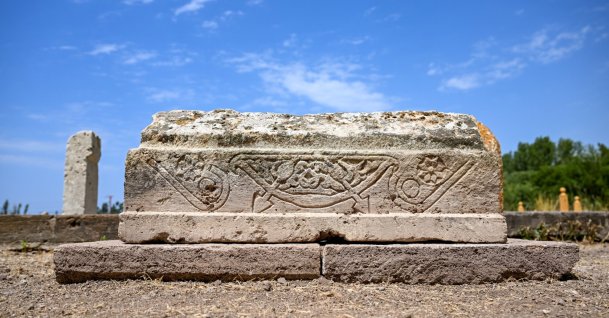 A child’s gravestone featuring a çovgan motif is seen at the historic Seljuk Cemetery, Gevaş district, Van, eastern Türkiye, July 30, 2026. (AA Photo)