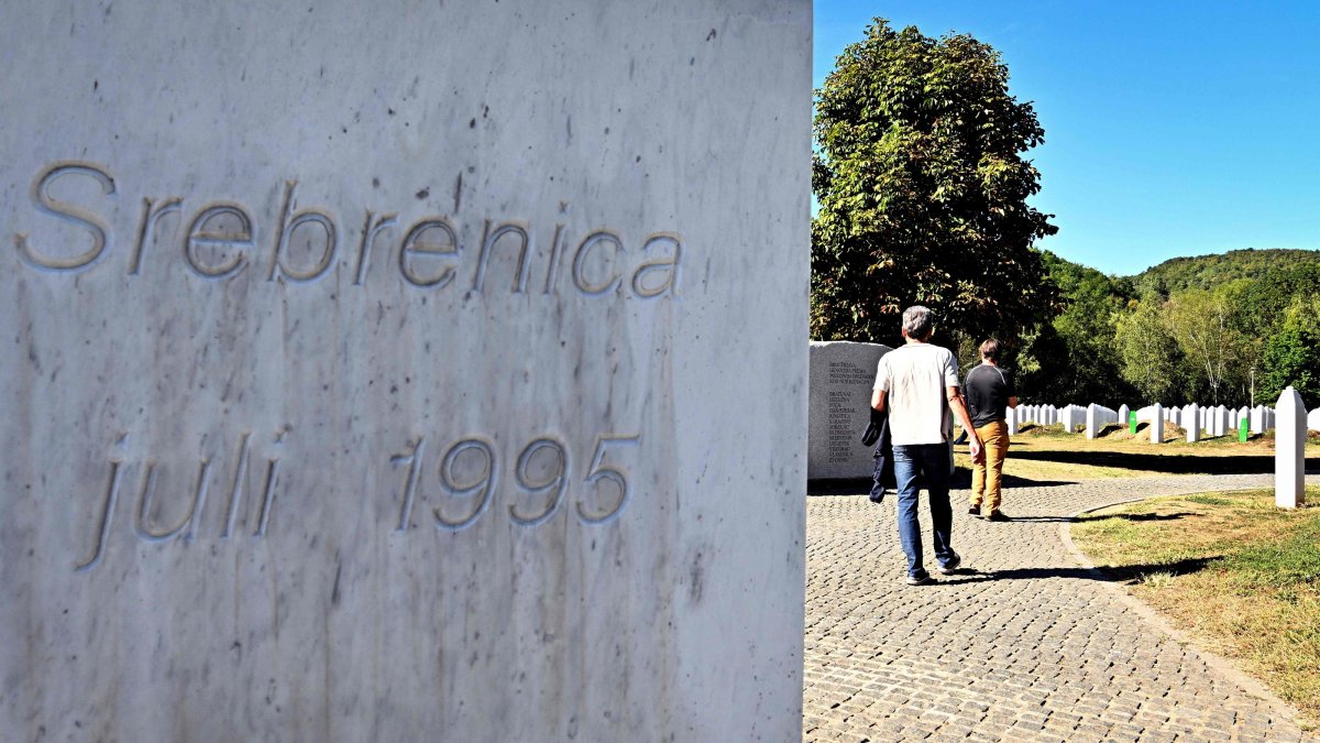 A visitor walks past a monument reading in tribute to the victims of the July 1995 Srebrenica massacre at a memorial cemetery, Potocari, Bosnia-Herzegovina, Sept. 7, 2026. (AFP Photo)