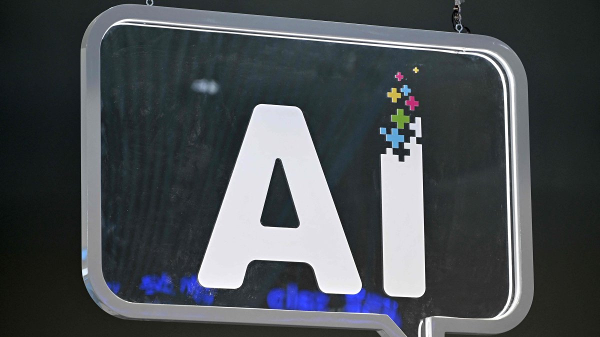 The wording "AI" is pictured at the Mobile World Congress (MWC), Barcelona, Spain, Feb. 27, 2024. (AFP Photo)