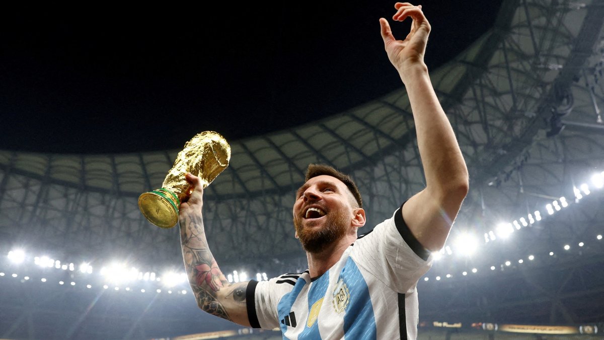 Argentina's Lionel Messi celebrates winning the World Cup with the trophy, Lusail, Qatar, Dec. 18, 2022. (Reuters Photo)