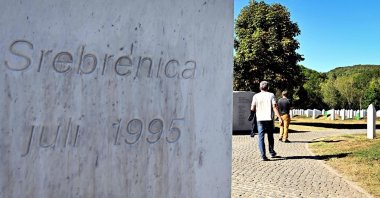 A visitor walks past a monument reading in tribute to the victims of the July 1995 Srebrenica massacre at a memorial cemetery, Potocari, Bosnia-Herzegovina, Sept. 7, 2026. (AFP Photo)
