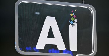The wording "AI" is pictured at the Mobile World Congress (MWC), Barcelona, Spain, Feb. 27, 2024. (AFP Photo)