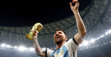 Argentina's Lionel Messi celebrates winning the World Cup with the trophy, Lusail, Qatar, Dec. 18, 2022. (Reuters Photo)