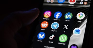 This photograph shows a set up smartphone screen displaying the logo of main social media platforms, Paris, France, April 29, 2026. (AFP Photo)