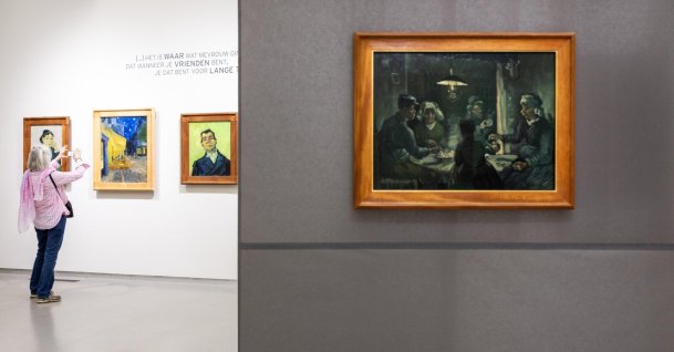 A visitor views the paintings (L-R) "Madame Ginoux," "Cafe Terrace at Night," "Portrait of Joseph-Michel Ginoux" and a preliminary study of "The Potato Eaters" by Vincent Van Gogh at the Kroller-Muller Museum, Otterlo, Netherlands, Sept. 15, 2026. (EPA Photo)
