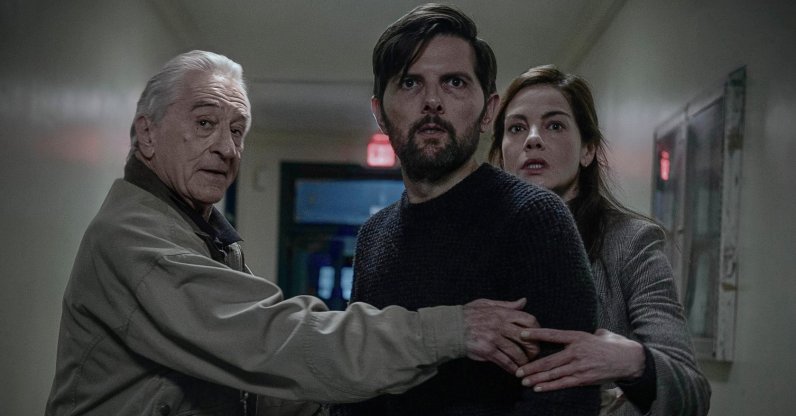 This image released by Netflix shows Robert De Niro (L)  Adam Scott (C) and Michelle Monaghan in a scene from "The Whisper Man." (AP Photo)