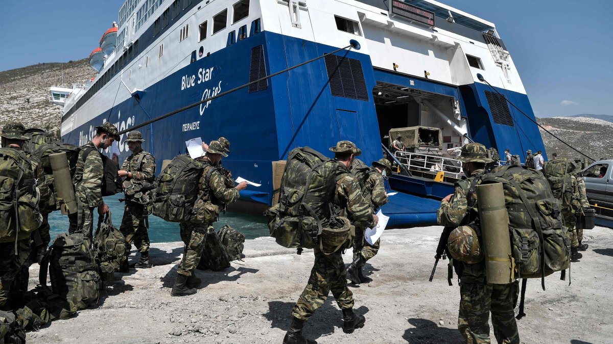 An undated photo of Greek soldiers preparing to board a ferry at the port of the tiny Greek island of Kastellorizo. (AFP Photo)