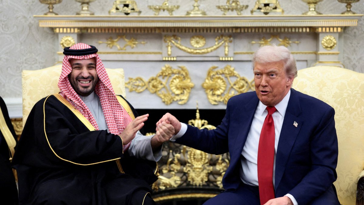 U.S. President Donald Trump and Saudi Crown Prince Mohammed bin Salman hold hands during a meeting in the Oval Office at the White House in Washington, D.C., U.S., Nov. 18, 2025. (Reuters Photo)