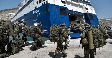 An undated photo of Greek soldiers preparing to board a ferry at the port of the tiny Greek island of Kastellorizo. (AFP Photo)