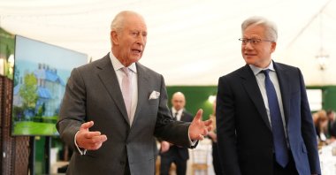 Britain's King Charles walks with Nvidia CEO Jensen Huang to a meeting for leaders from the AI sector, governments and thought leaders to discuss how AI can be developed and deployed in ways that benefit society, at Dumfries House in Cumnock, Britain, Sept. 17, 2026. (Reuters Photo)