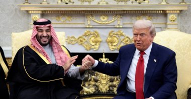 U.S. President Donald Trump and Saudi Crown Prince Mohammed bin Salman hold hands during a meeting in the Oval Office at the White House in Washington, D.C., U.S., Nov. 18, 2025. (Reuters Photo)