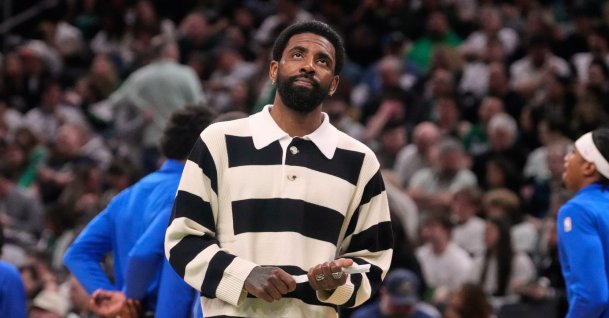 Dallas Mavericks guard Kyrie Irving on the bench during an NBA basketball game, in Boston, U.S., March 6, 2026. (AP Photo)