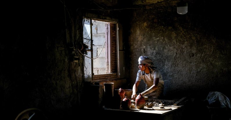 Hamad Yahya Jasim works on a pottery piece at his workshop in the Deir el-Zour countryside, Syria, Sept. 10, 2026. (AA Photo)