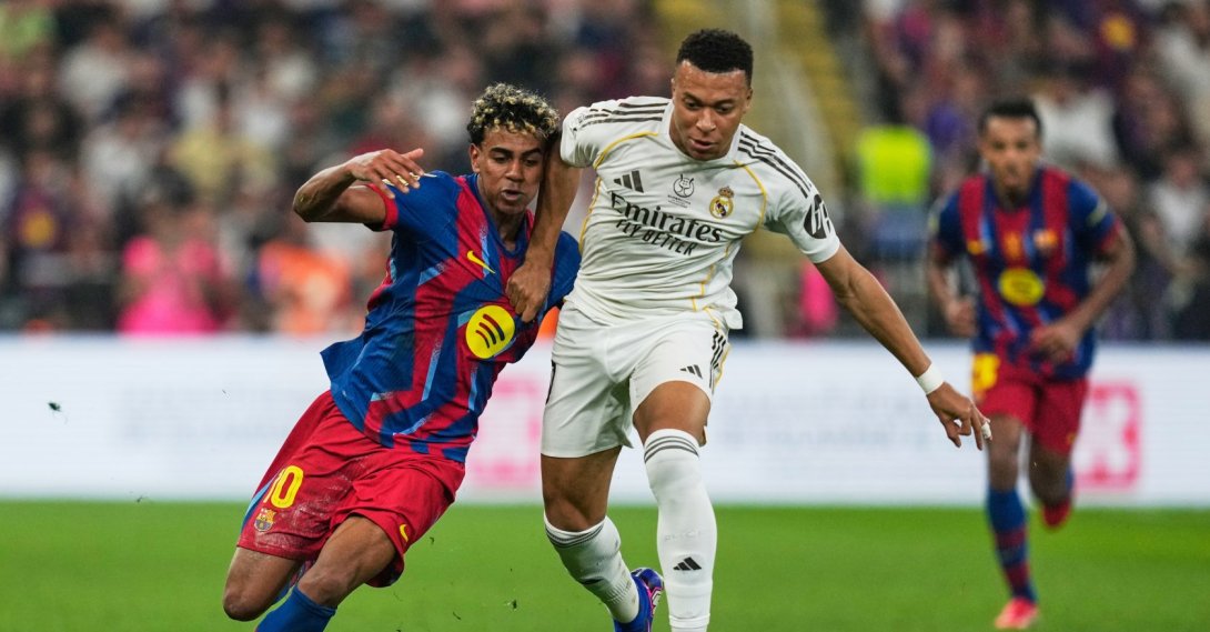 Barcelona's Lamine Yamal (L) duels for the ball with Real Madrid's Kylian Mbappe during the Spanish Super Cup final at King Abdullah Sports City Stadium in Jeddah, Saudi Arabia, Jan. 11, 2026. (AP Photo)