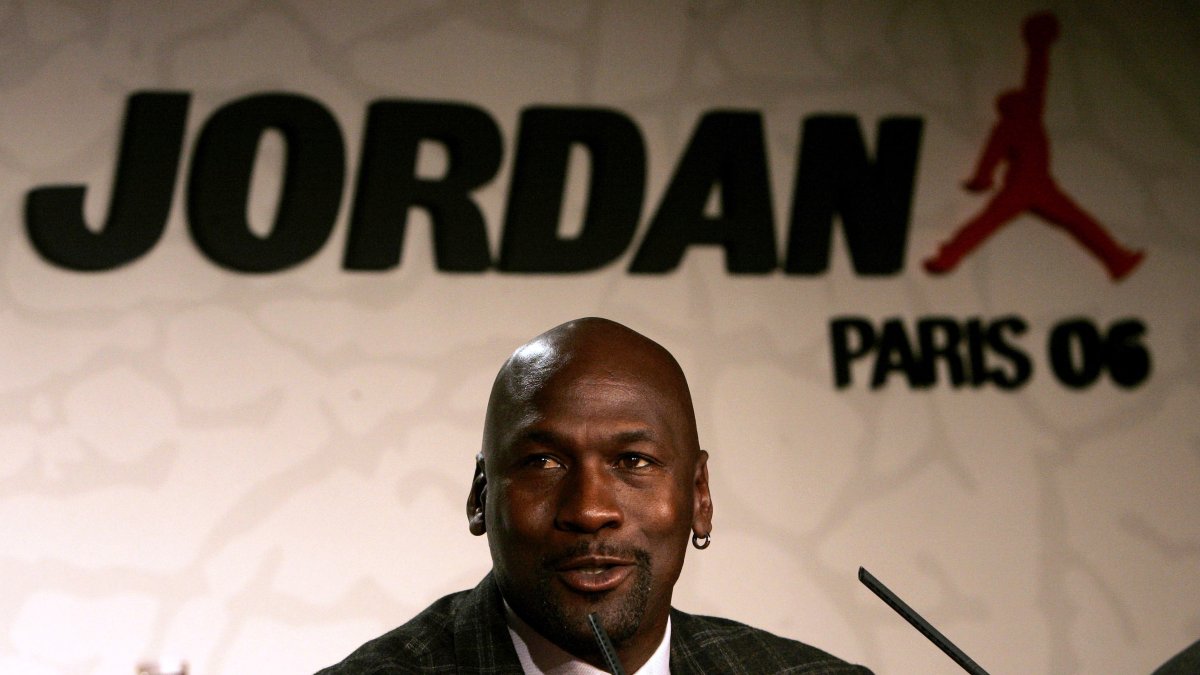 Michael Jordan speaks during a press conference to promote his new sportswear collection for Jordan Brand, a sub-brand of Nike, Paris, France, Oct. 17, 2006. (AP Photo)