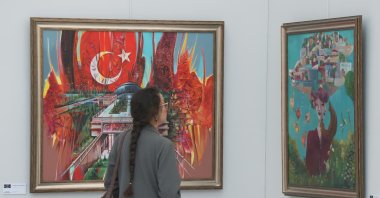 A museum visitor visits the “Ankara Resimleniyor,” “Young Art: 7th Poster Design Competition,” “The Meeting of Colors and Dialogue of Two Cultures,” and ASELSAN’s “A Vision for an Upcycled Future” exhibitions during the Türkiye Culture Route Festival, Ankara, Türkiye, Sept. 18, 2026. (AA Photo)
