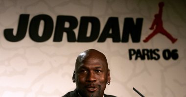 Michael Jordan speaks during a press conference to promote his new sportswear collection for Jordan Brand, a sub-brand of Nike, Paris, France, Oct. 17, 2006. (AP Photo)