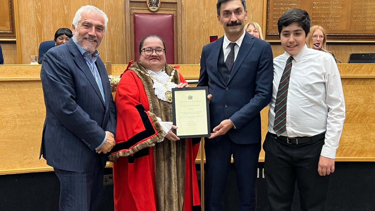 Onur Inci (2nd R) receives the Merton Heroes Award from the Merton Council, London, U.K., Sept. 16, 2026. (Photo courtesy of Alpaslan Düven)