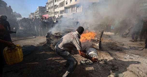 Palestinians attempt to extinguish a burning vehicle that was struck by an Israeli airstrike in Gaza City, Palestine, Sept. 19, 2026. (AFP Photo)
