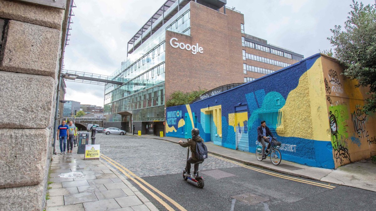 Members of the public pass the offices of Google in the business and financial sector, Dublin, Ireland, Oct. 7, 2021. (AFP Photo)