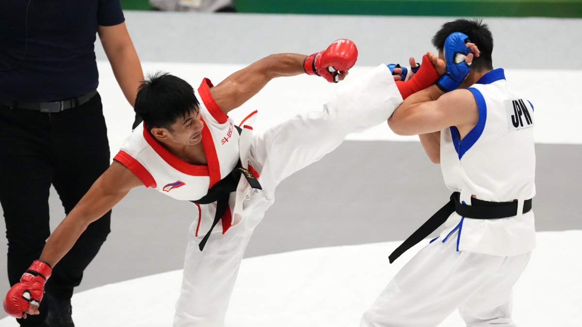 Jean Claude Saclag (L) of the Philippines and Daisuke Maruyama of Japan compete during the Mixed Martial Arts Men's Traditional -65kg Semifinals at the 20th Asian Games Aichi-Nagoya, in Nagoya, Japan, Sept. 21, 2026. (Getty Images Photo)