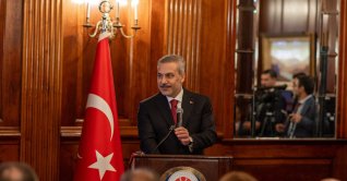 Foreign Minister Hakan Fidan speaks at the "Türkiye-U.S. Relations Toward the 100th Anniversary" panel organized by the Presidency's Directorate of Communications in New York, Sept. 21, 2026. (AA Photo)