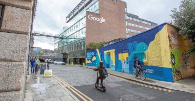 Members of the public pass the offices of Google in the business and financial sector, Dublin, Ireland, Oct. 7, 2021. (AFP Photo)