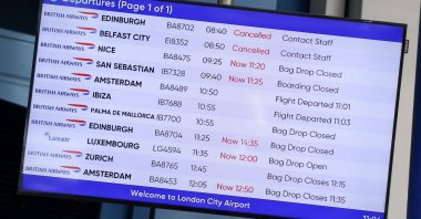 A departure board displays delayed and canceled flights at London City Airport as flights are affected by an air traffic control failure linked to NATS' Prestwick center in Scotland, disrupting flights across northern England, Scotland and Northern Ireland, London, Britain, Sept. 21, 2026. (Reuters Photo)