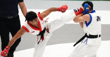 Jean Claude Saclag (L) of the Philippines and Daisuke Maruyama of Japan compete during the Mixed Martial Arts Men's Traditional -65kg Semifinals at the 20th Asian Games Aichi-Nagoya, in Nagoya, Japan, Sept. 21, 2026. (Getty Images Photo)